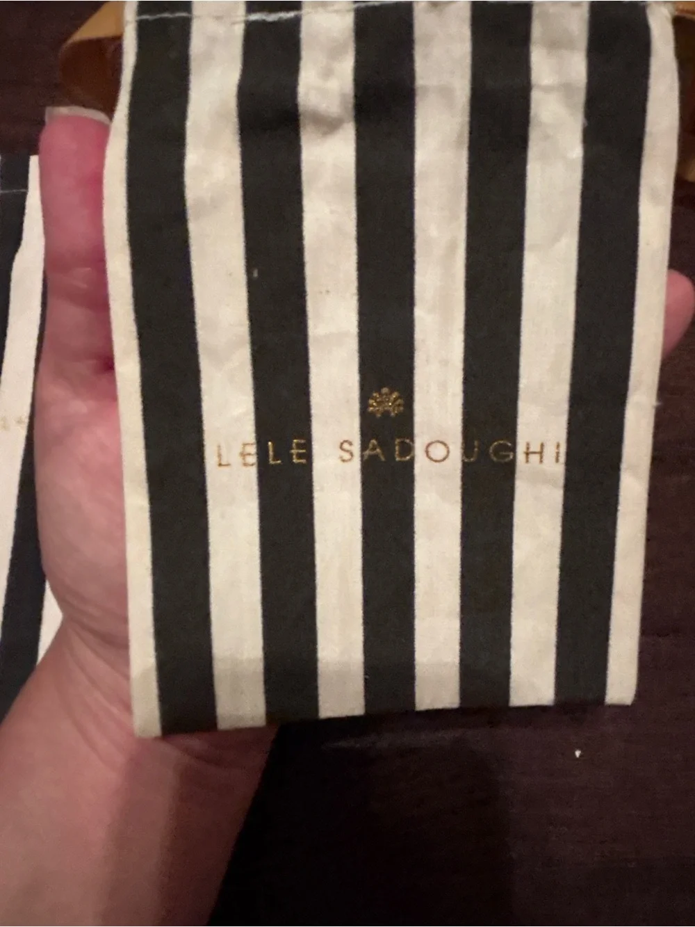 Lele Sadoughi Black and White Striped Drawstring Pouches with Gold Logo